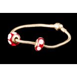 A 14CT GOLD PANDORA BRACELET, with two Murano glass charms