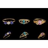 A LOT OF THREE GEM SET DRESS RINGS mounted on 14ct yellow gold