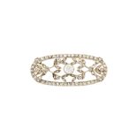 AN EDWARDIAN DIAMOND SET BROOCH, of oval form with floral motifs, set throughout with diamonds of