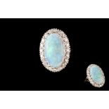 AN OPAL AND DIAMOND OVAL CLUSTER RING,