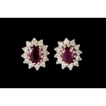 A PAIR OF RUBY AND DIAMOND OVAL CLUSTER EARRINGS
