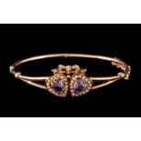 A VICTORIAN AMETHYST AND SEED PEARL BANGLE IN YELLOW GOLD.