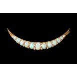 AN OPAL AND DIAMOND OPEN CRESCENT BROOCH,