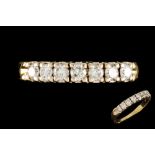 A DIAMOND SEVEN STONE HALF ETERNITY RING,