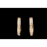 A PAIR OF HALF HOOP DIAMOND EARRINGS,