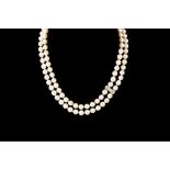 A PEARL NECKLACE, with diamond set clasp,