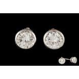 A PAIR OF DIAMOND SOLITAIRE STUD EARRINGS, two round brilliant cut diamonds of approx 1.