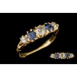 A LATE VICTORIAN SAPPHIRE AND DIAMOND CARVED DRESS RING, mounted in 18ct gold.