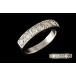 A DIAMOND HALF ETERNITY RING, of approx. 1.