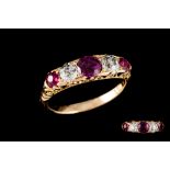 A VICTORIAN RUBY AND DIAMOND CARVED DRESS RING, with rubies of approx. 0.