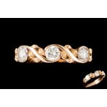 A THREE STONE DIAMOND RING,