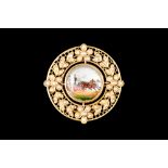 AN ESSEX GLASS AND SEED PEARL BROOCH, depicting a coach and horses, mounted in yellow gold.
