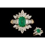 AN EMERALD AND DIAMOND FANCY CLUSTER RING, mounted in 18ct yellow and white gold.