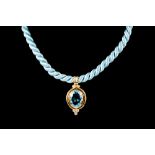 A BLUE TOPAZ PENDANT, of approx. 30.00ct, with diamonds of approx. 0.36ct in total on blue rope