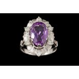 AN AMETHYST AND DIAMOND DRESS RING,