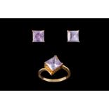 AN AMETHYST DRESS RING;