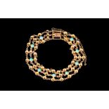 A THREE ROW TURQUOISE SET BRACELET IN 9CT GOLD.