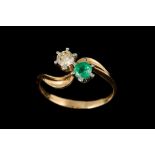 AN EMERALD AND DIAMOND TOI ET MOI RING,