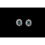 A PAIR OF BLUE TOPAZ AND DIAMOND CLUSTER EARRINGS