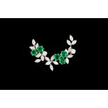 AN EMERALD AND DIAMOND FLORAL CRESCENT BROOCH, with emeralds of approx. 1.