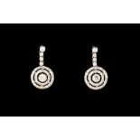 A PAIR OF DIAMOND PENDANT DROP EARRINGS, of round target form, with diamonds of approx. 1.