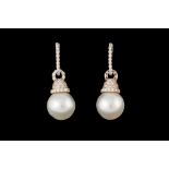 A PAIR OF SOUTH SEA CULTURED PEARL AND DIAMOND DROP EARRINGS