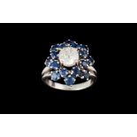 A DIAMOND AND SAPPHIRE FLORAL CLUSTER RING, with centre diamond of approx. 1.