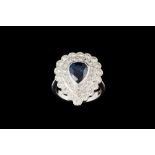 A SAPPHIRE AND DIAMOND PEAR SHAPE CLUSTER RING, with one pear cut sapphire of approx 2.
