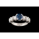 A SAPPHIRE AND DIAMOND RING, one cushion cut sapphire of approx 1.20ct and diamonds of approx 1.