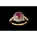 AN ANTIQUE RUBY AND DIAMOND CLUSTER RING,