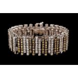 A DIAMOND BRACELET, with yellowish brown and white diamonds of approx. 8.