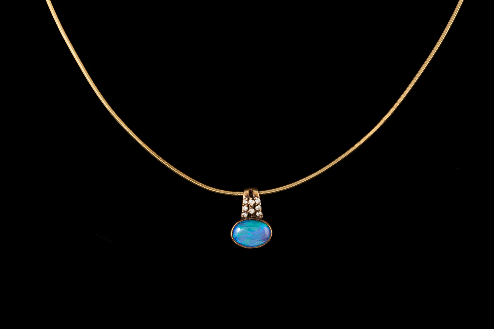 AN OPAL AND DIAMOND PENDANT,