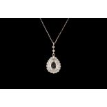 AN EDWARDIAN DIAMOND PENDANT AND CHAIN, one pear shape diamond of approx 1.