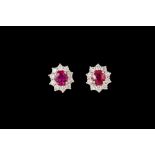 A PAIR OF DIAMOND AND RUBY CLUSTER EARRINGS,