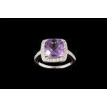 AN AMETHYST AND DIAMOND CLUSTER RING,
