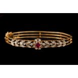 A RUBY AND DIAMOND BANGLE, with ruby of approx. 0.