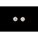 A PAIR OF DIAMOND SOLITAIRE EARRINGS, with EGL cert stating the diamonds to be 1.05ct and 1.