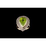 A PERIDOT AND DIAMOND CLUSTER RING,