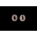 A PAIR OF DIAMOND AND GARNET SHIELD CLUSTER EARRINGS