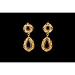 A PAIR OF GARNET DROP EARRINGS, in 14ct gold filigree settings.