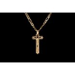 AN 18CT YELLOW GOLD CRUCIFIX,