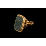 AN ANTIQUE GOLD FOB,