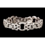 AN EARLY 20TH CENTURY DIAMOND BRACELET, set throughout with diamonds of approx. 6.