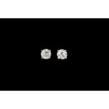 A PAIR OF DIAMOND SOLITAIRE STUD EARRINGS, with two diamonds of approx 1.