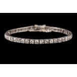 A DIAMOND LINE BRACELET, of approx. 5.00ct in total, mounted in platinum, c.