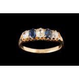 A LATE VICTORIAN SAPPHIRE AND DIAMOND CARVED DRESS RING, with sapphires of approx. 0.