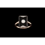 AN ONYX AND DIAMOND PLAQUE RING, one round brilliant cut diamond of approx 0.25ct.
