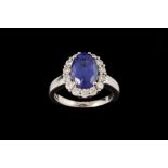 A TANZANITE AND DIAMOND CLUSTER RING, with tanzanite of approx. 3.50ct, diamonds of approx. 0.