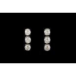 A PAIR OF DIAMOND EARRINGS BY THEO FENNELL, with diamonds of approx. 2.