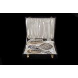 A FOUR PIECE SILVER HALLMARKED DRESSING TABLE SET,